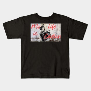 Girl biker painted on a wall Kids T-Shirt